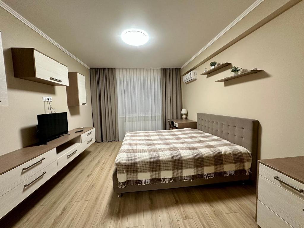 En eller flere senge i et værelse på Apartament Confortabil!