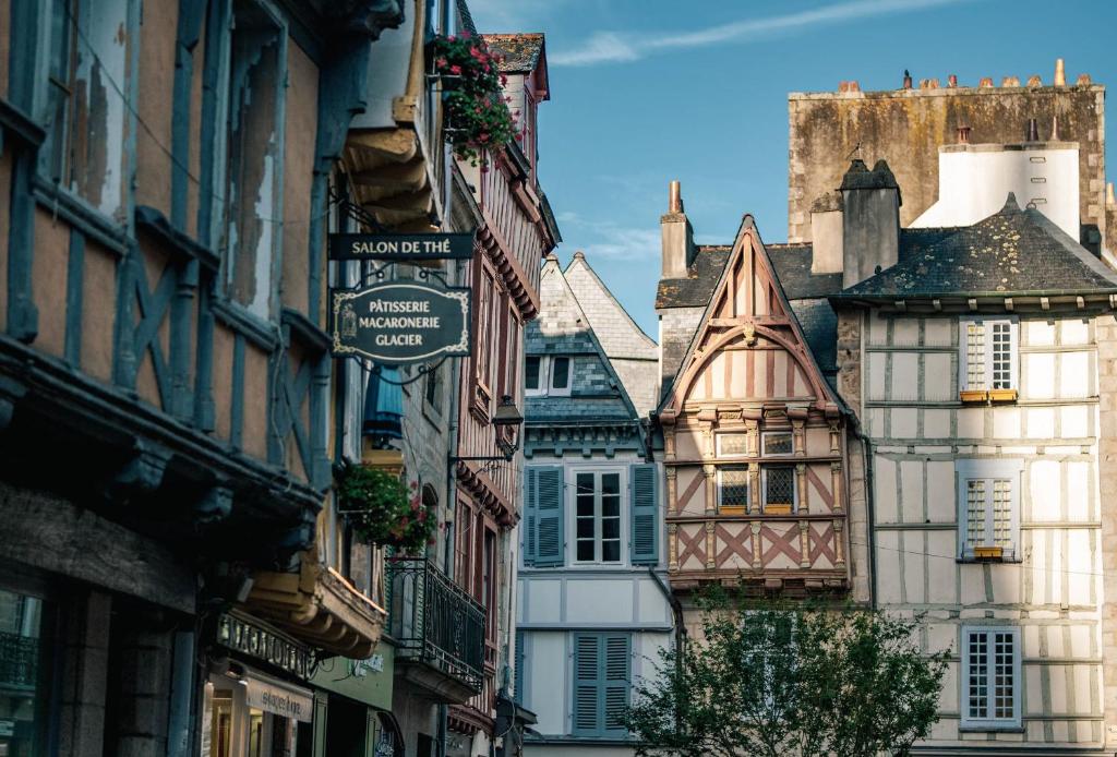 a group of buildings on a street in a city at Glamping Bretagne in Quimper