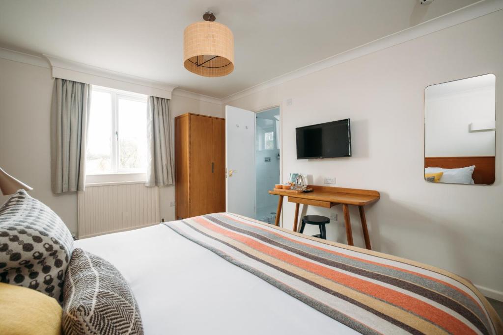 TV a/nebo společenská místnost v ubytování Hotel Meudon