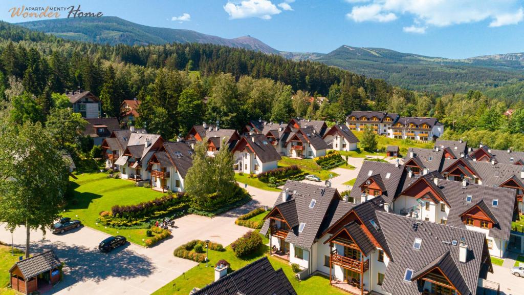 an aerial view of a village with houses at Wonder Home - Domki górskie z kominkami na kameralnym osiedlu - plac zabaw na terenie kompleksu in Karpacz