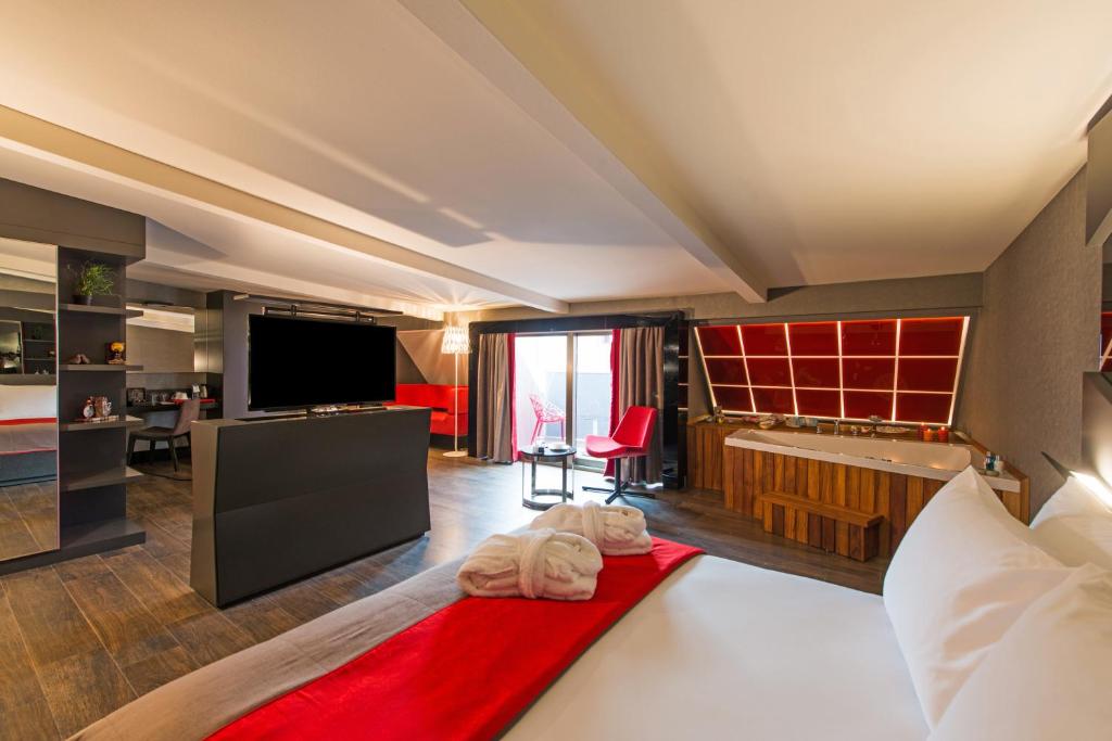 a hotel room with a large bed and a television at Hotel Favori Nisantasi in Istanbul