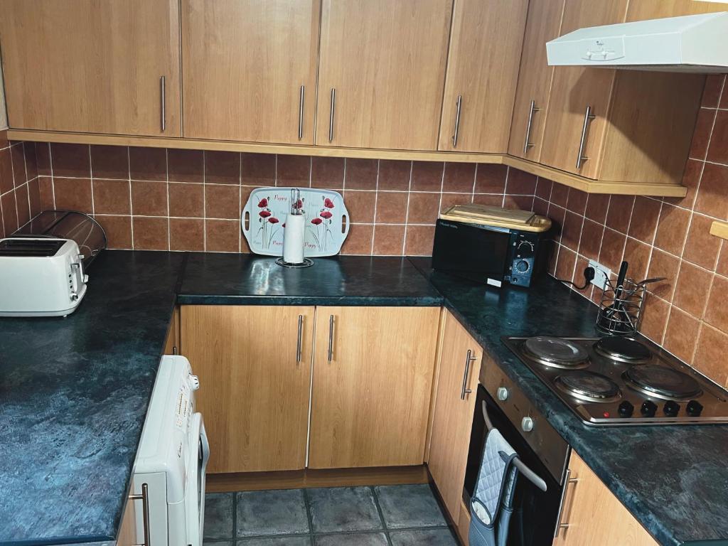 Kuchyň nebo kuchyňský kout v ubytování Feorline Cottage