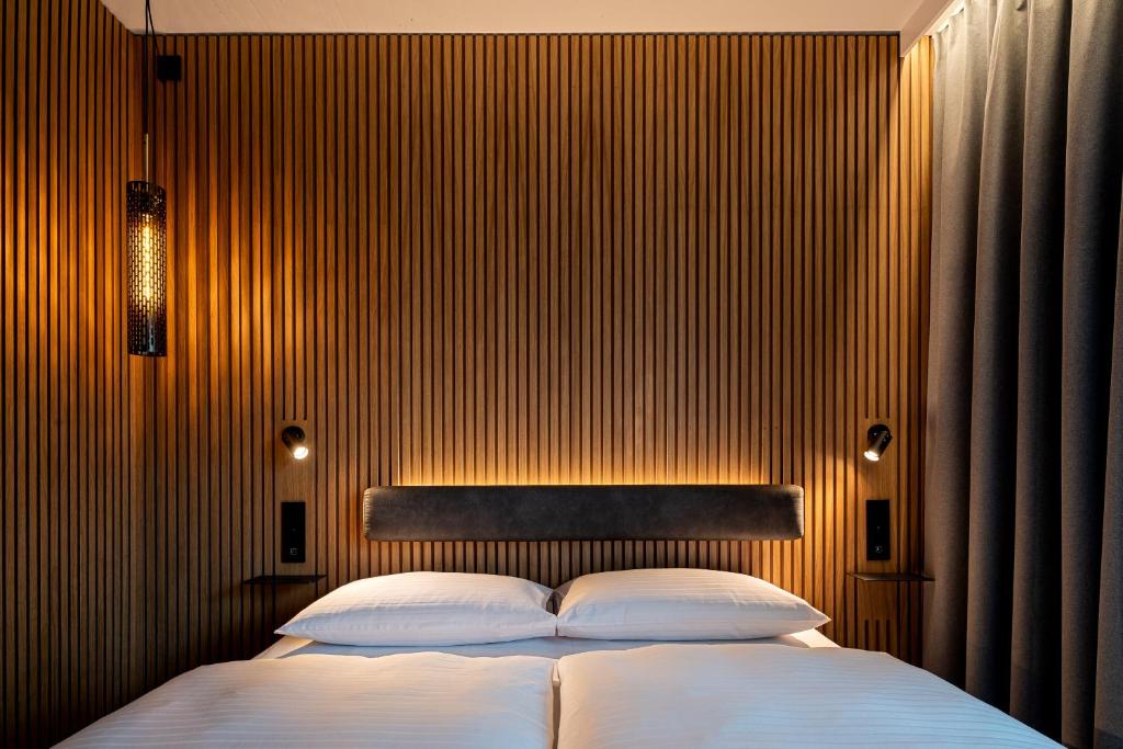 Postel nebo postele na pokoji v ubytování Zleep Hotel Prague