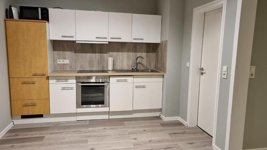 Kuchyň nebo kuchyňský kout v ubytování Haus Spökenkieker Loppersum