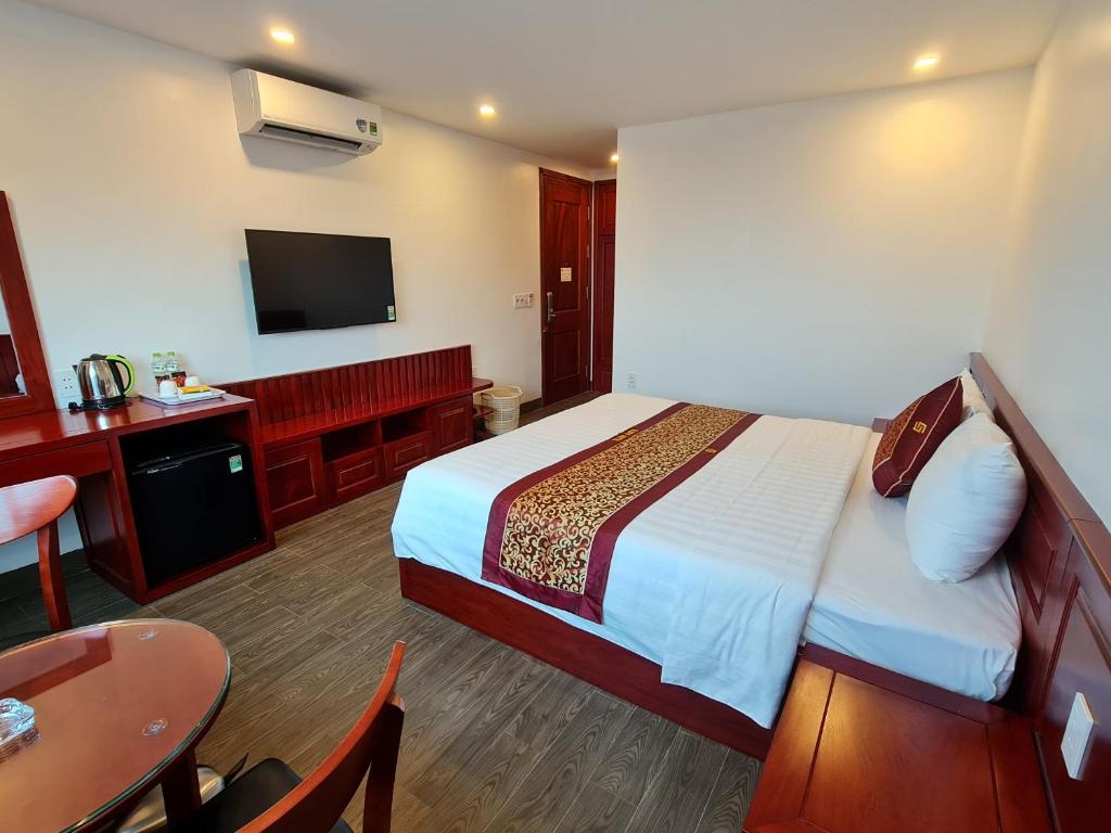 Giường trong phòng chung tại glory 3 hotel 北宁格洛瑞3好酒店