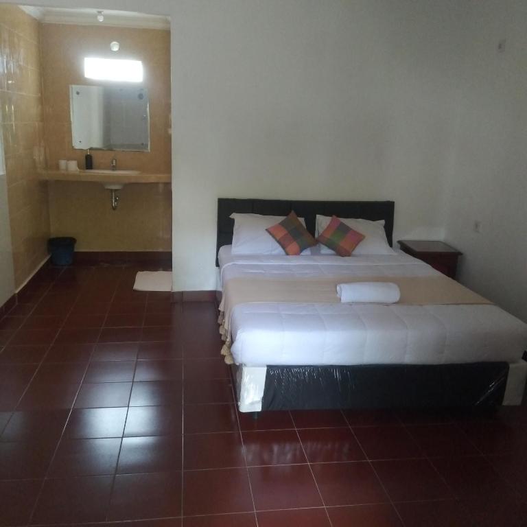 Postel nebo postele na pokoji v ubytování Inn Between