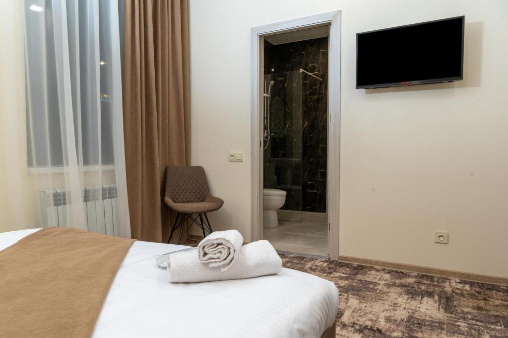 TV a/nebo společenská místnost v ubytování Aeka hotel