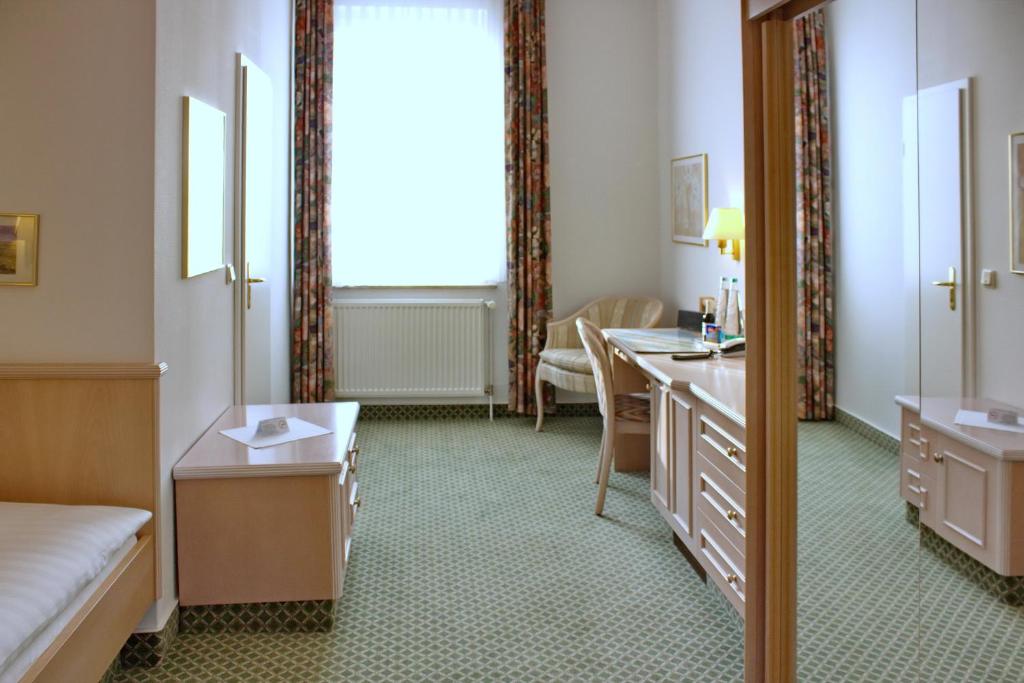 Postel nebo postele na pokoji v ubytování Hotel Westfalenhof