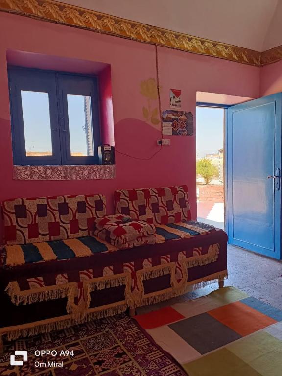 Postel nebo postele na pokoji v ubytování Miral Nubian House