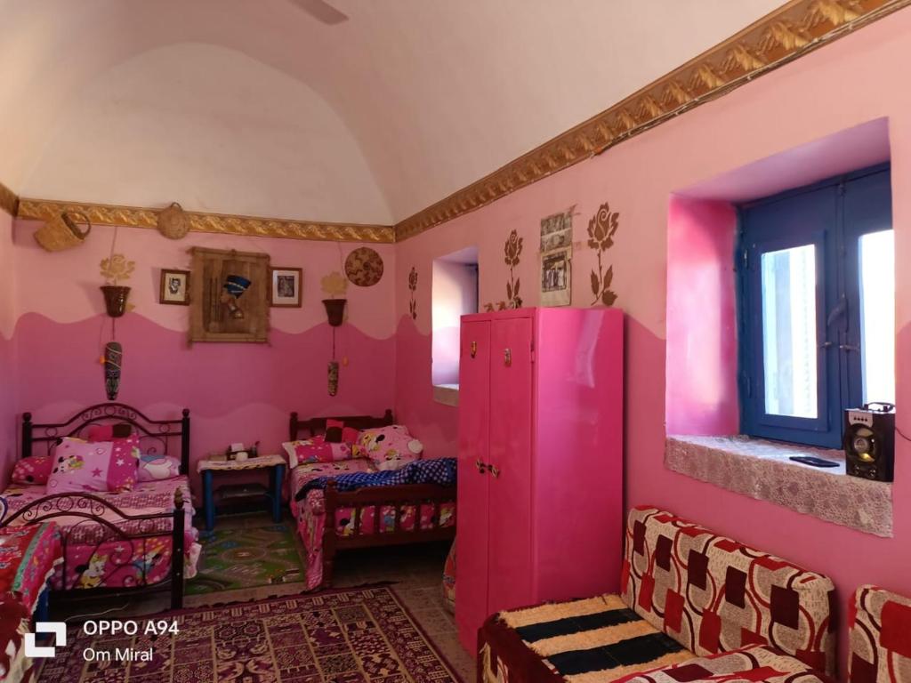 Postel nebo postele na pokoji v ubytování Miral Nubian House