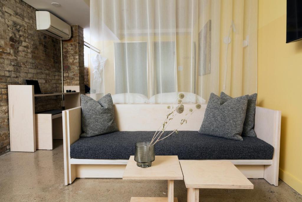 a living room with a couch and a table at Ode in Toronto