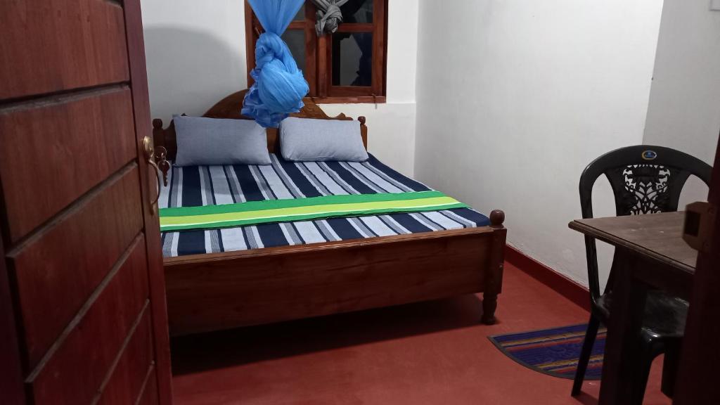 Postel nebo postele na pokoji v ubytování Sewana Guest INN