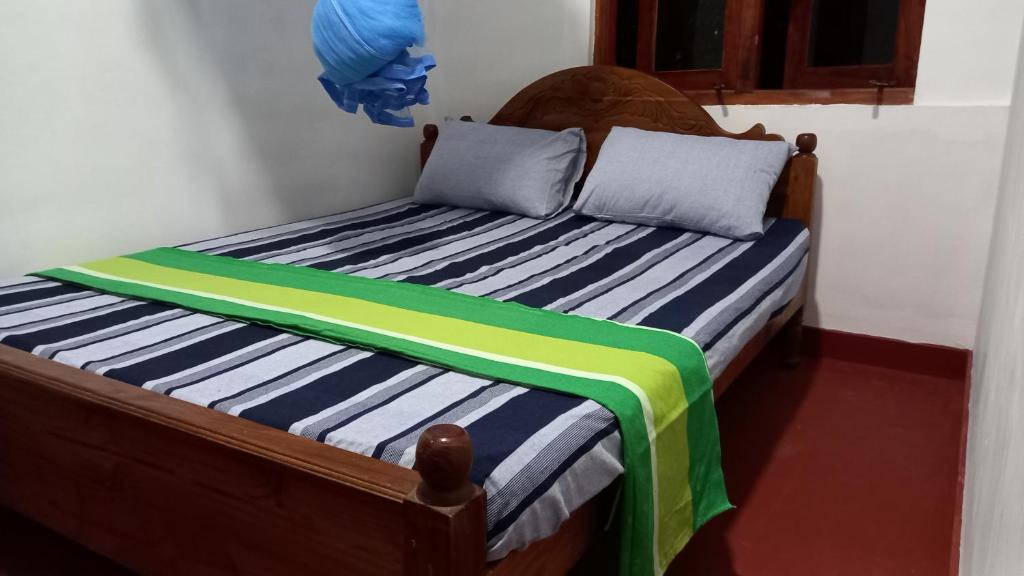 Postel nebo postele na pokoji v ubytování Sewana Guest INN
