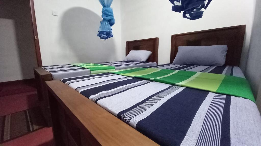 Postel nebo postele na pokoji v ubytování Sewana Guest INN