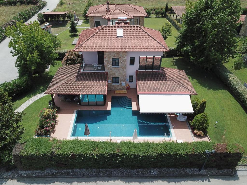 an aerial view of a house with a swimming pool at Iliana in Skotína