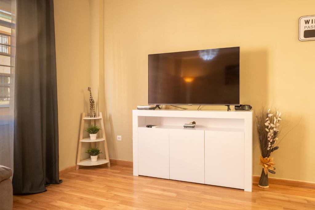 Televízia a/alebo spoločenská miestnosť v ubytovaní Casa unifamiliar