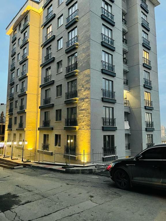 a car parked in front of a tall building at Cantrmen Suites in Istanbul