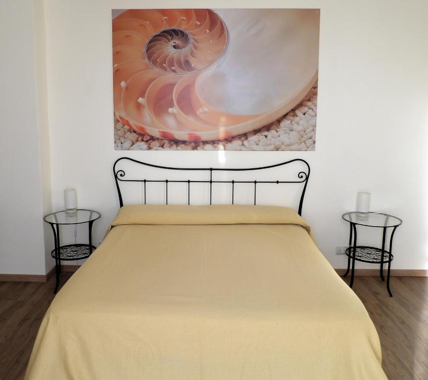 Postel nebo postele na pokoji v ubytování B&B Stella Marina