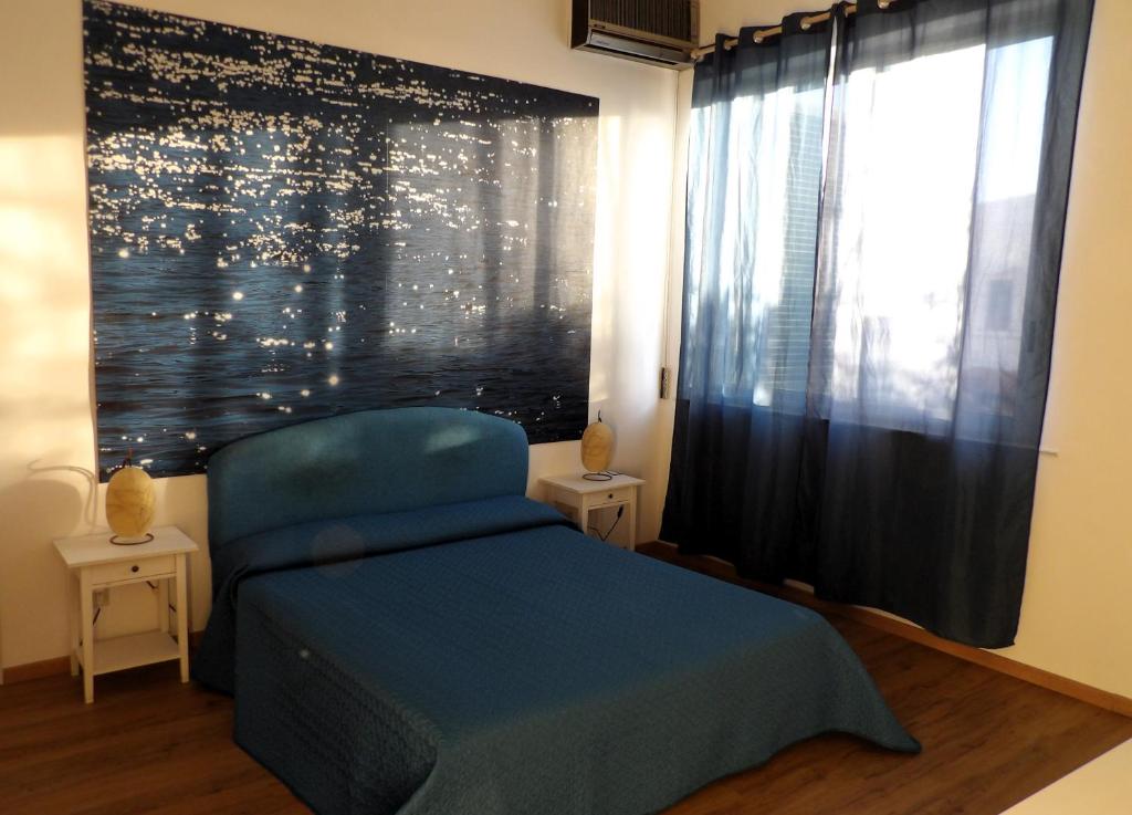 Postel nebo postele na pokoji v ubytování B&B Stella Marina