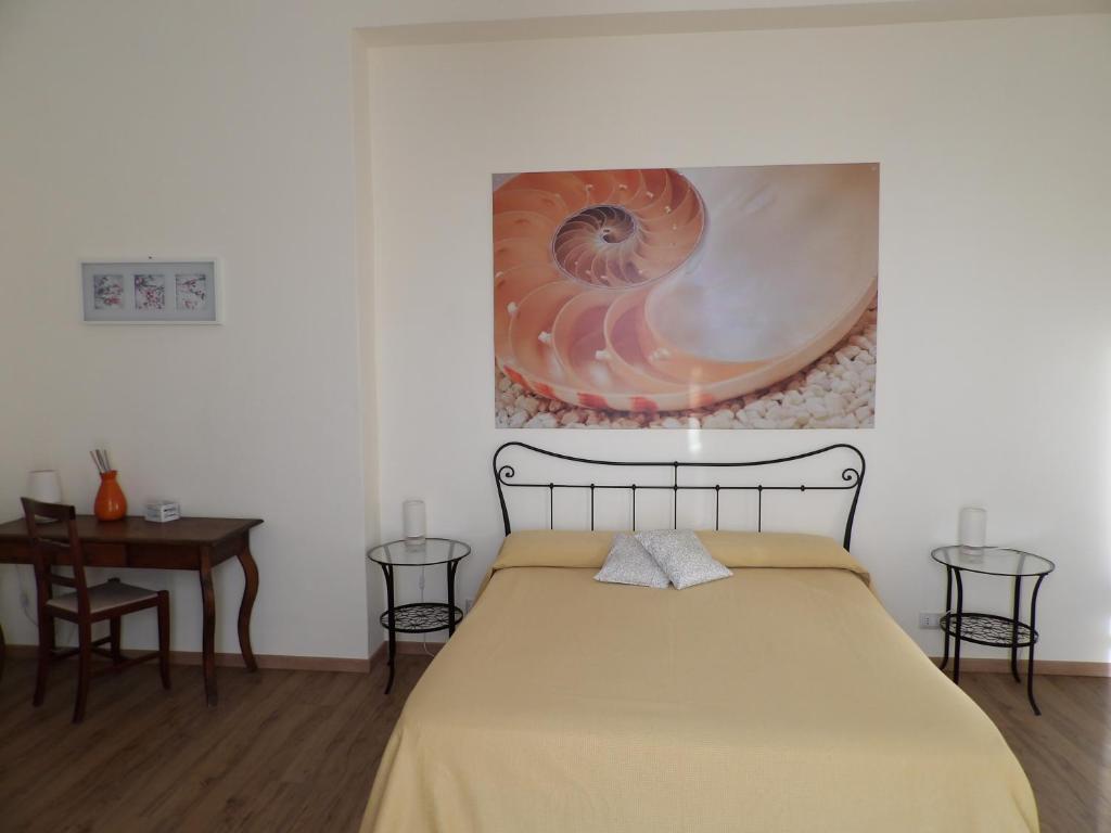 Postel nebo postele na pokoji v ubytování B&B Stella Marina