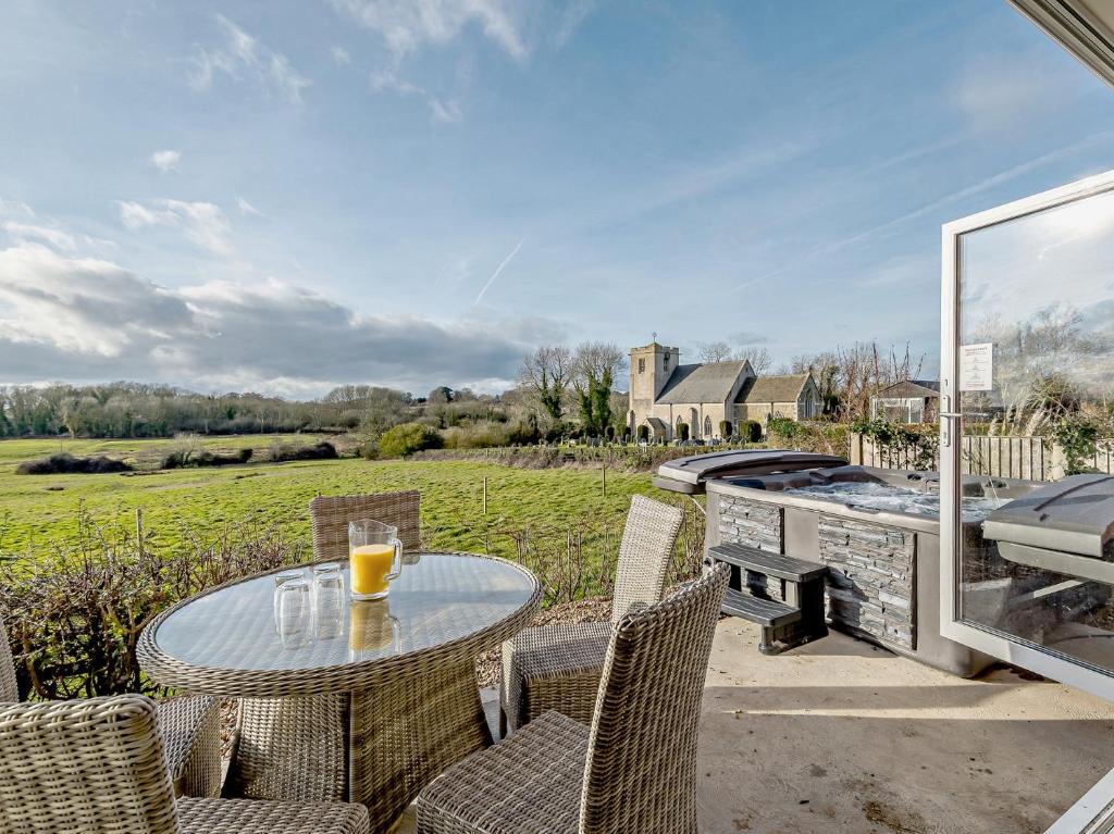 a patio with a table and chairs and a grill at 3 Bed in Skendleby 91142 in Skendleby