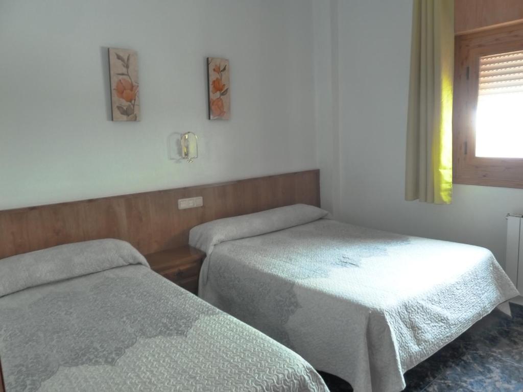Postel nebo postele na pokoji v ubytování Apartamentos Casa FERMINA - A 2 horas de las pistas de esquí