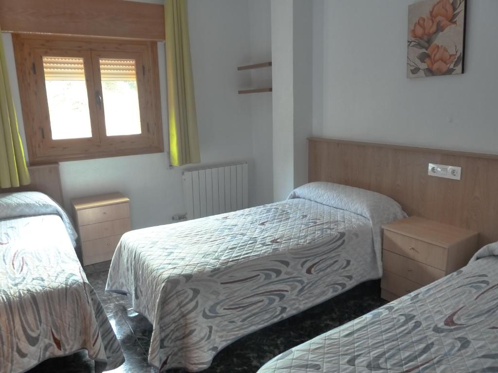 Postel nebo postele na pokoji v ubytování Apartamentos Casa FERMINA - A 2 horas de las pistas de esquí