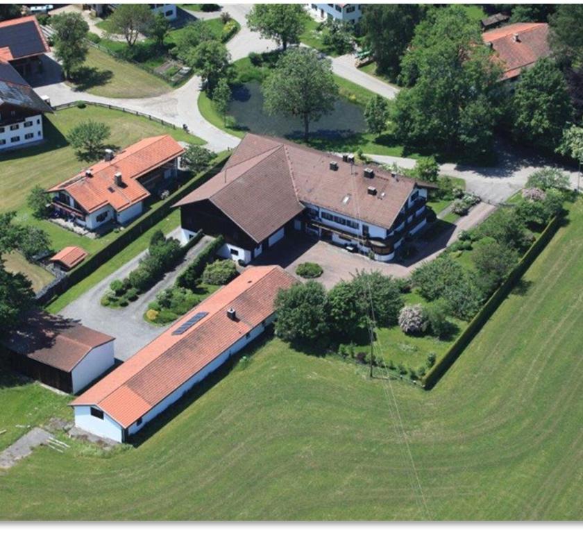an aerial view of a large house with a yard at Der Gschwendtnerhof in Valley