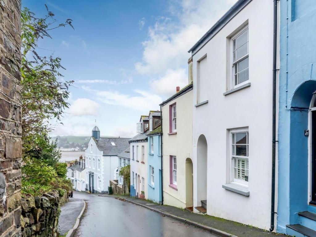 a street in kinsale ireland with white and blue houses at 2 Bed in Appledore 63084 in Appledore