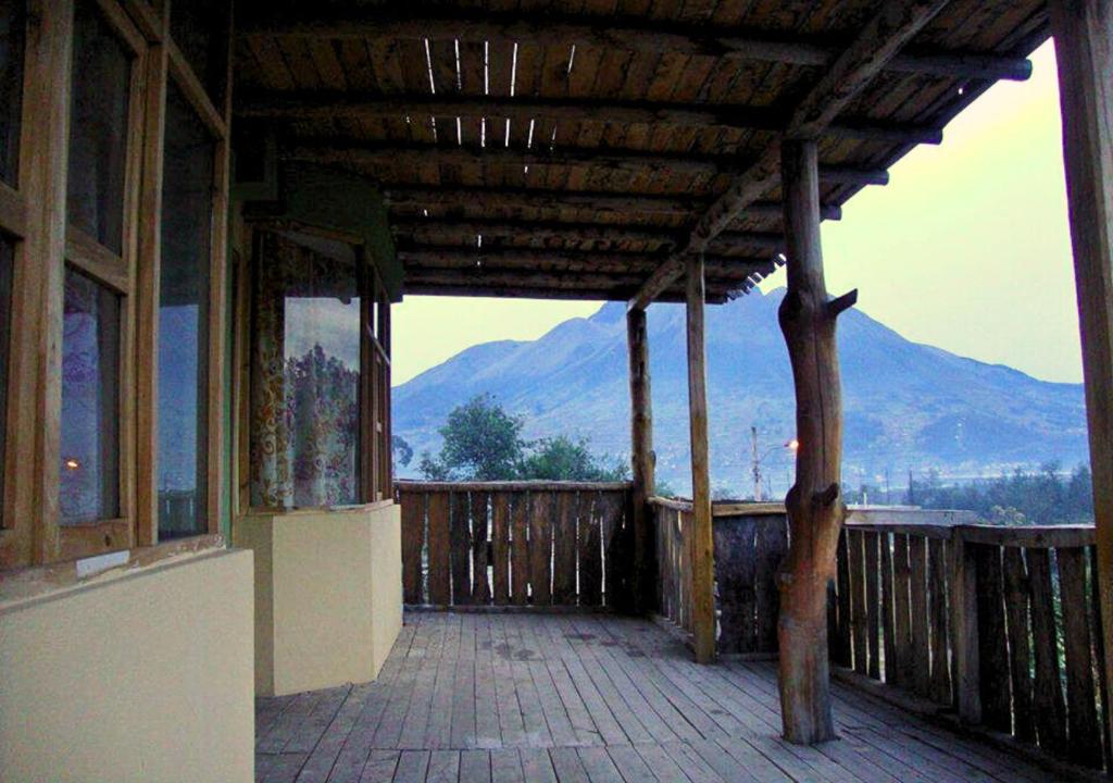 a porch of a house with a view of a mountain at Hotel IntyKucha in San Rafael