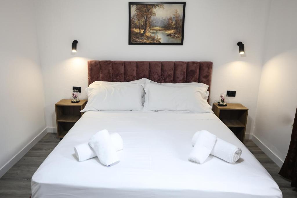 Postel nebo postele na pokoji v ubytování Vila Alizee Hotel