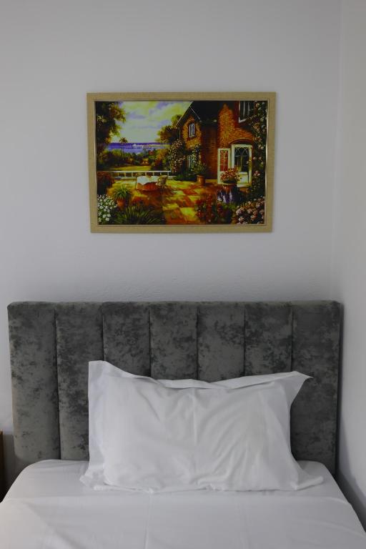 Postel nebo postele na pokoji v ubytování Vila Alizee Hotel