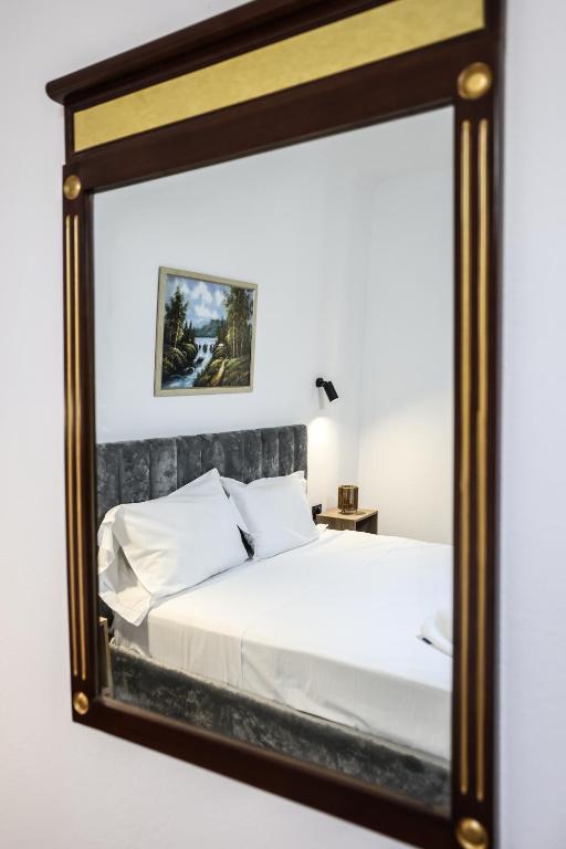 Postel nebo postele na pokoji v ubytování Vila Alizee Hotel
