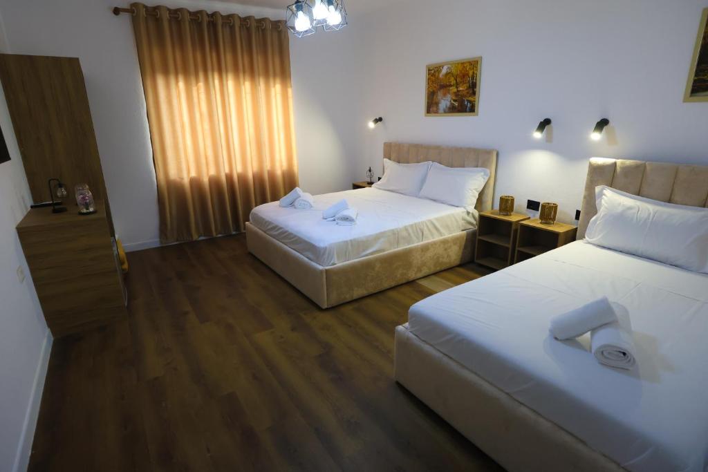 Postel nebo postele na pokoji v ubytování Vila Alizee Hotel