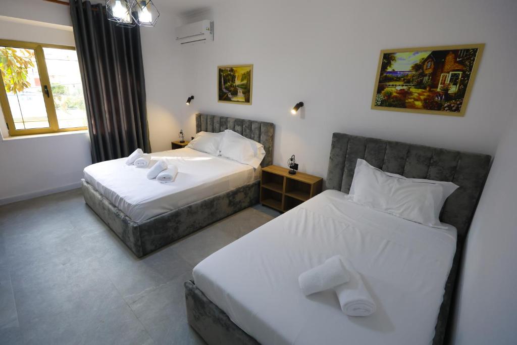 Postel nebo postele na pokoji v ubytování Vila Alizee Hotel