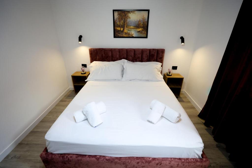 Postel nebo postele na pokoji v ubytování Vila Alizee Hotel