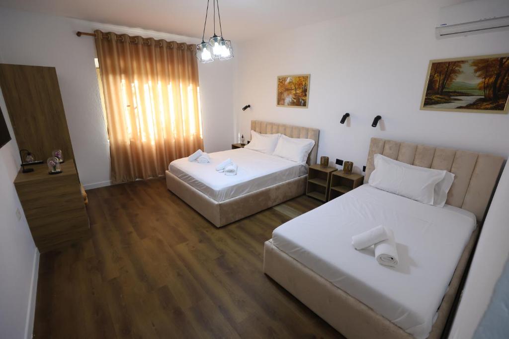 Postel nebo postele na pokoji v ubytování Vila Alizee Hotel