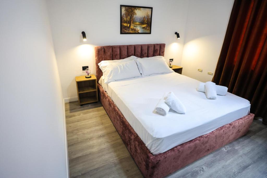 Postel nebo postele na pokoji v ubytování Vila Alizee Hotel