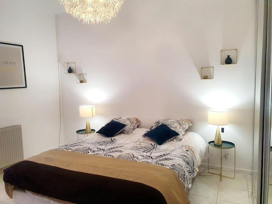 En eller flere senge i et værelse på Maison Mariese - Montaudran - 2 chambres