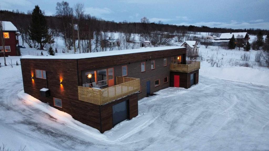 a house in the snow in the snow at Tromsø stunning Luxury apart B in Tromsø