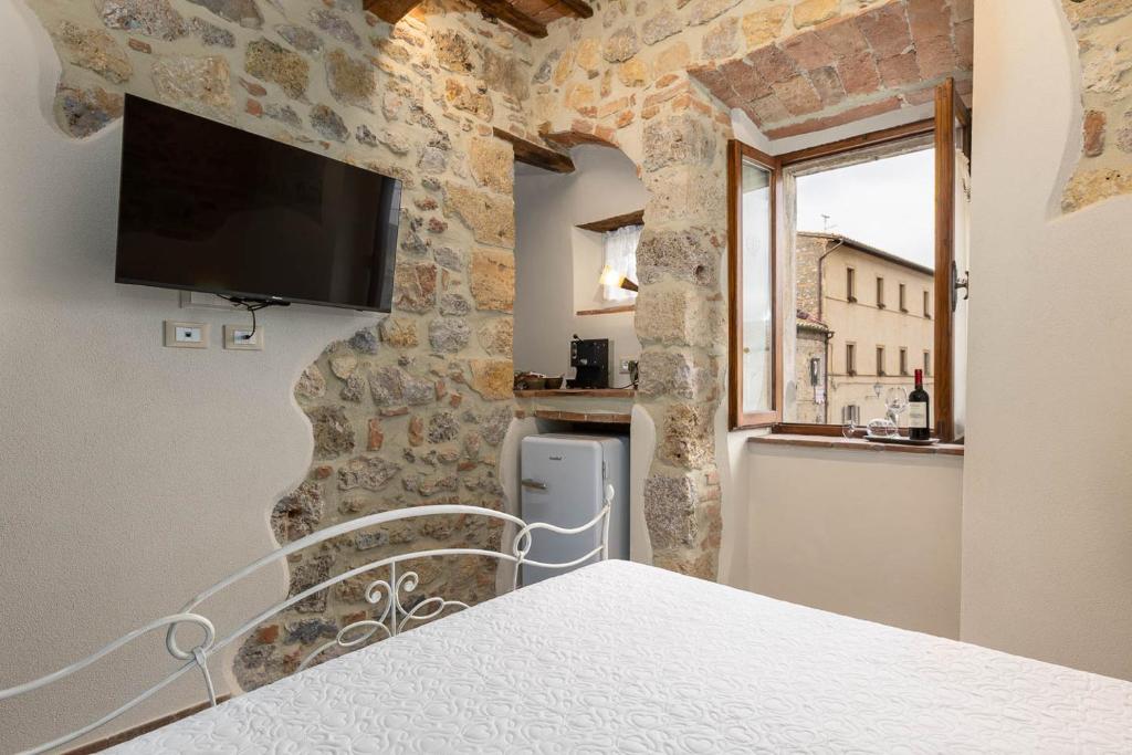TV a/nebo společenská místnost v ubytování Sognare nel Castello