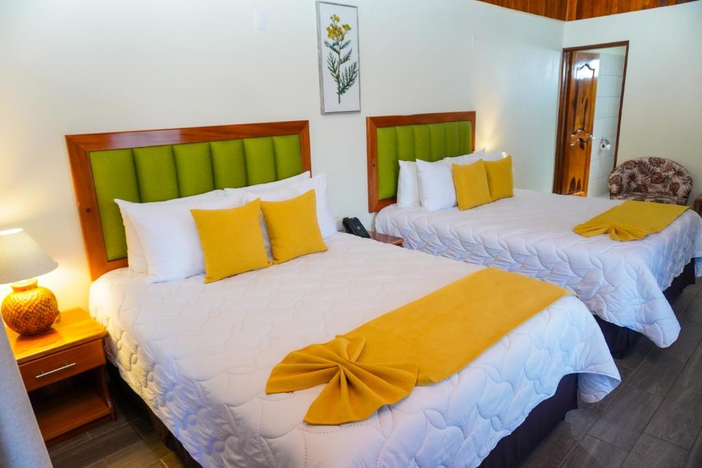 Postel nebo postele na pokoji v ubytování Sibu Boutique Hotel