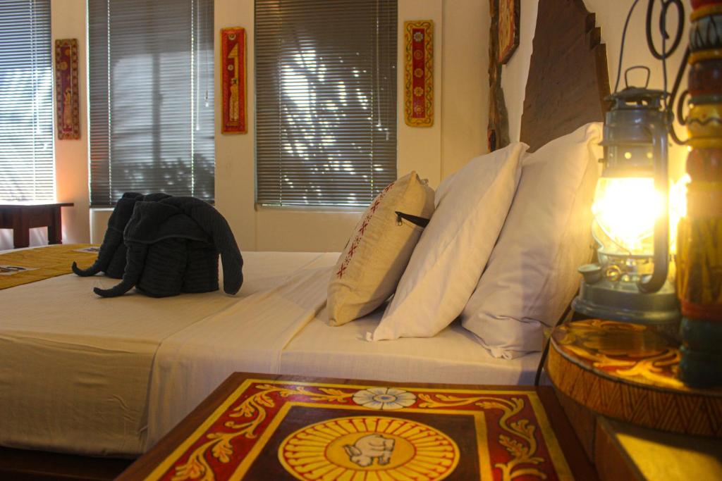 Postel nebo postele na pokoji v ubytování Villa Olde Ceylon