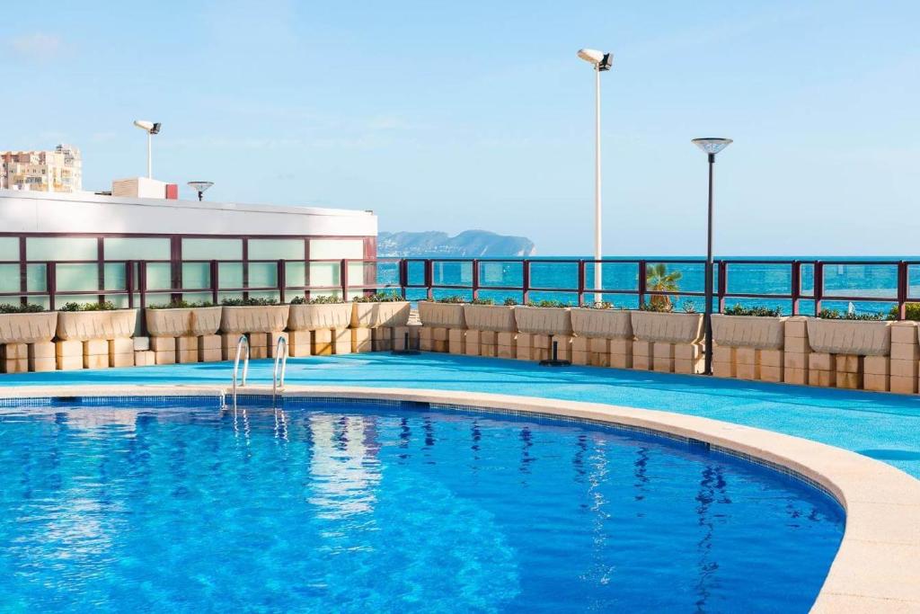 a swimming pool on the top of a building at Apartamento Topacio 2 - PlusHolidays in Calpe