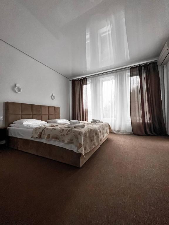 Postel nebo postele na pokoji v ubytování Hotel Continent