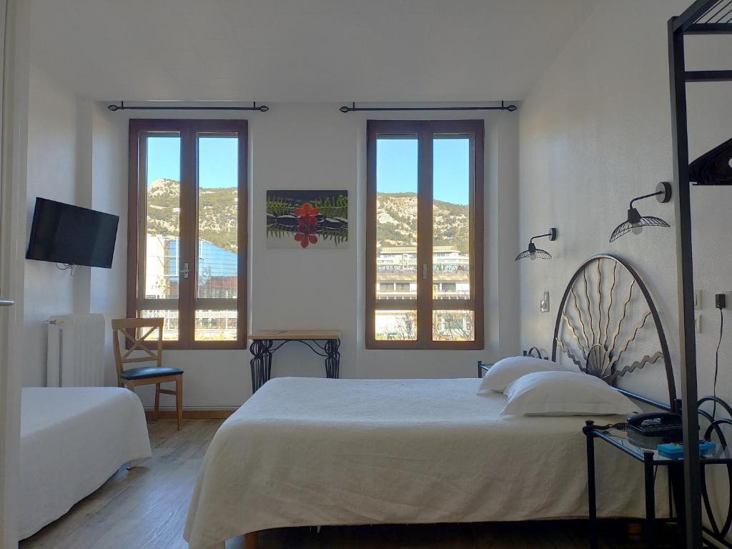 Postel nebo postele na pokoji v ubytování Au Nouvel Hôtel