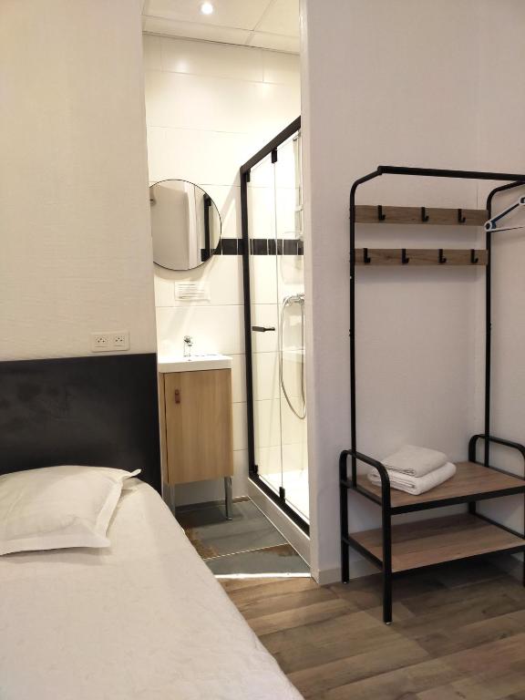 Postel nebo postele na pokoji v ubytování Au Nouvel Hôtel