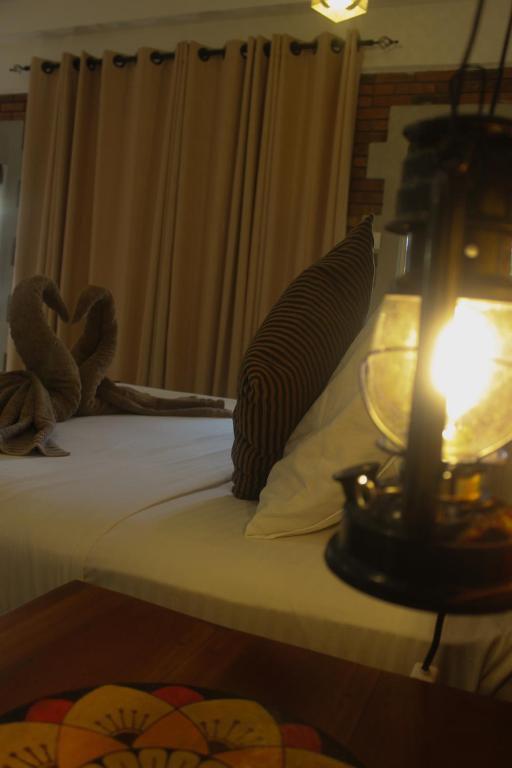 Postel nebo postele na pokoji v ubytování Villa Olde Ceylon