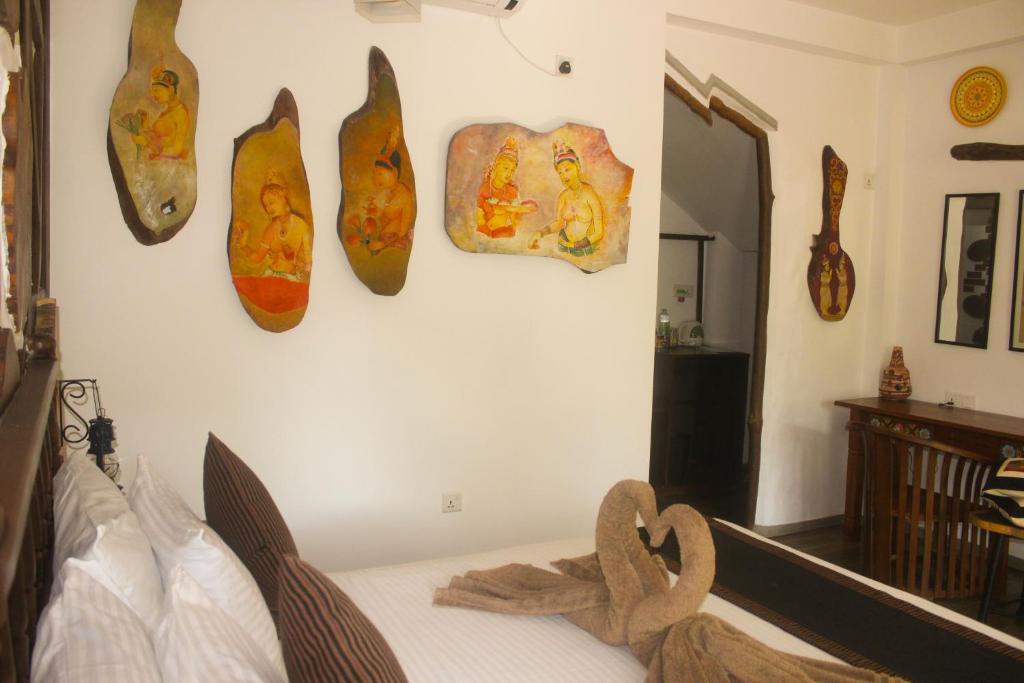 Postel nebo postele na pokoji v ubytování Villa Olde Ceylon