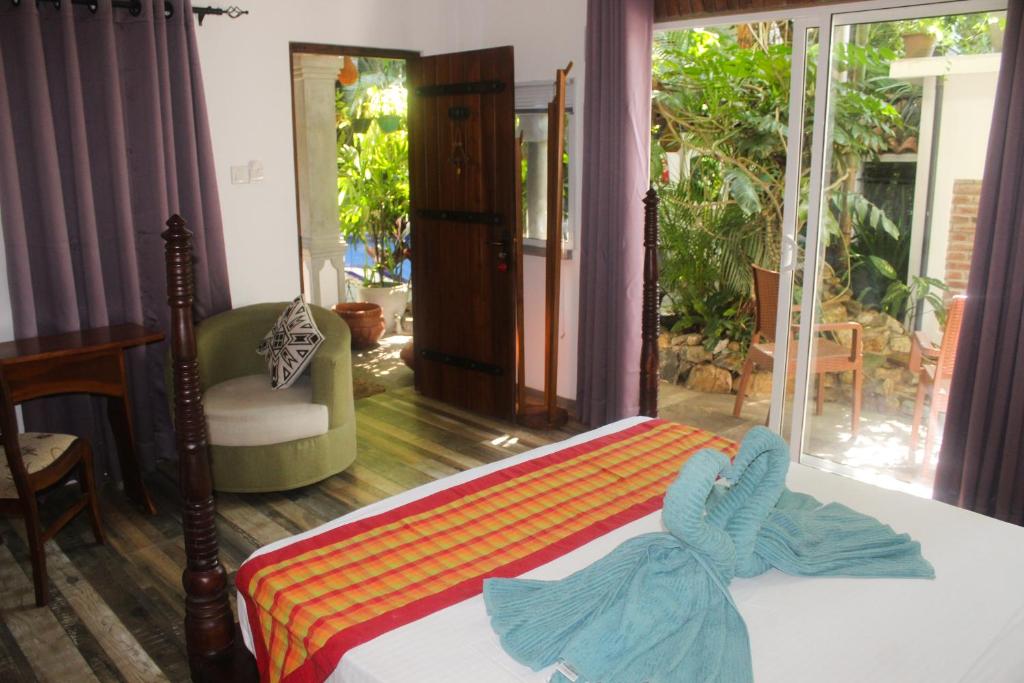 Postel nebo postele na pokoji v ubytování Villa Olde Ceylon